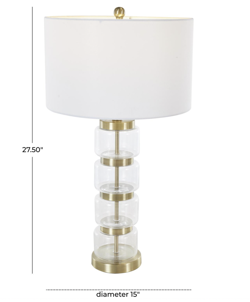 Lampara dorada y vidrio transparente